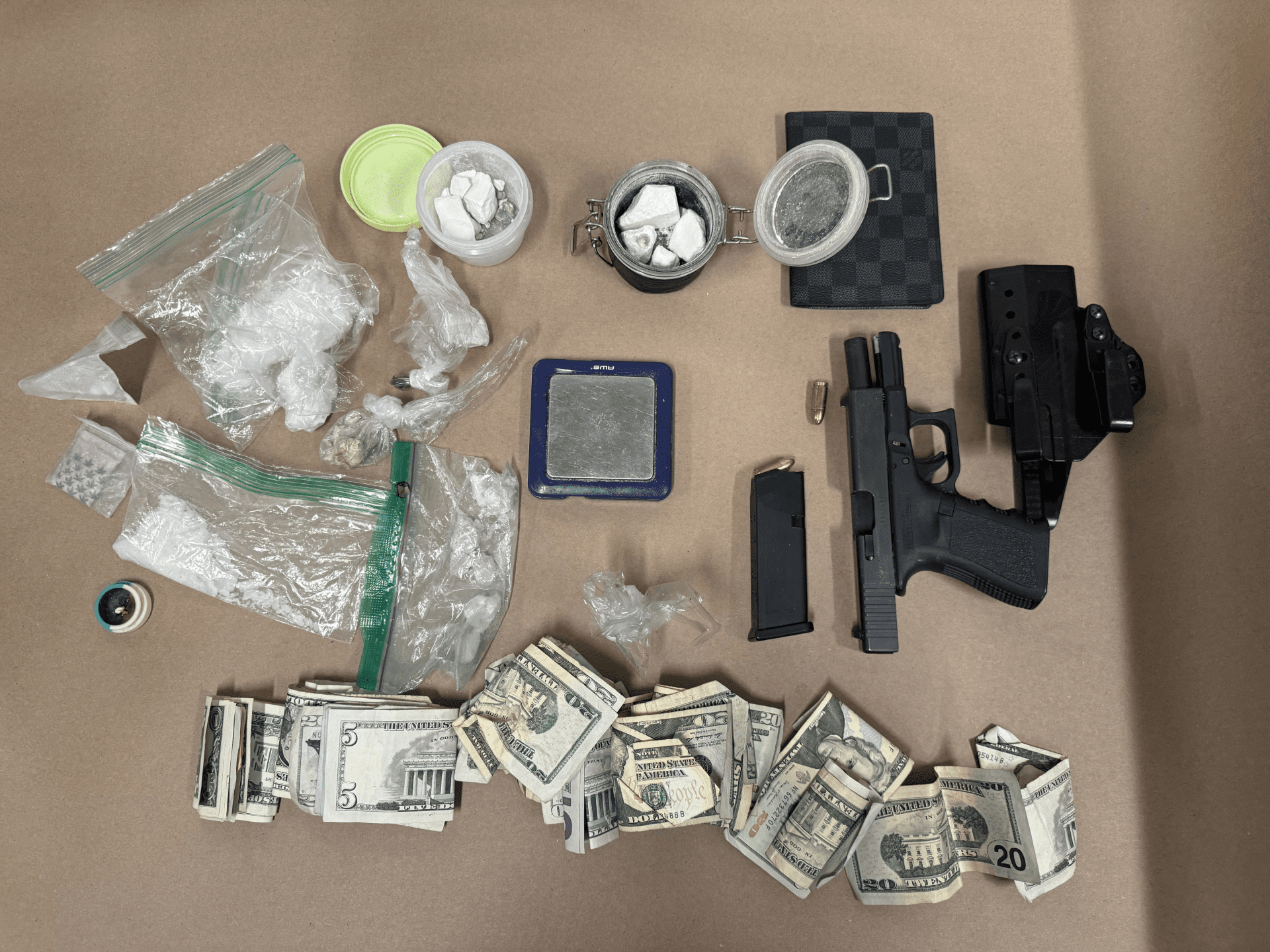 Seattle police officers recovered drugs, cash, and a gun as evidence of a crime.
