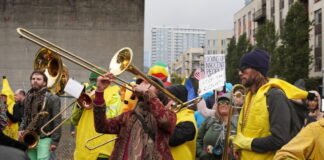 A band plays at a protests at the Immigration and Customs Enforcement facility south of downtown Portland on Sunday