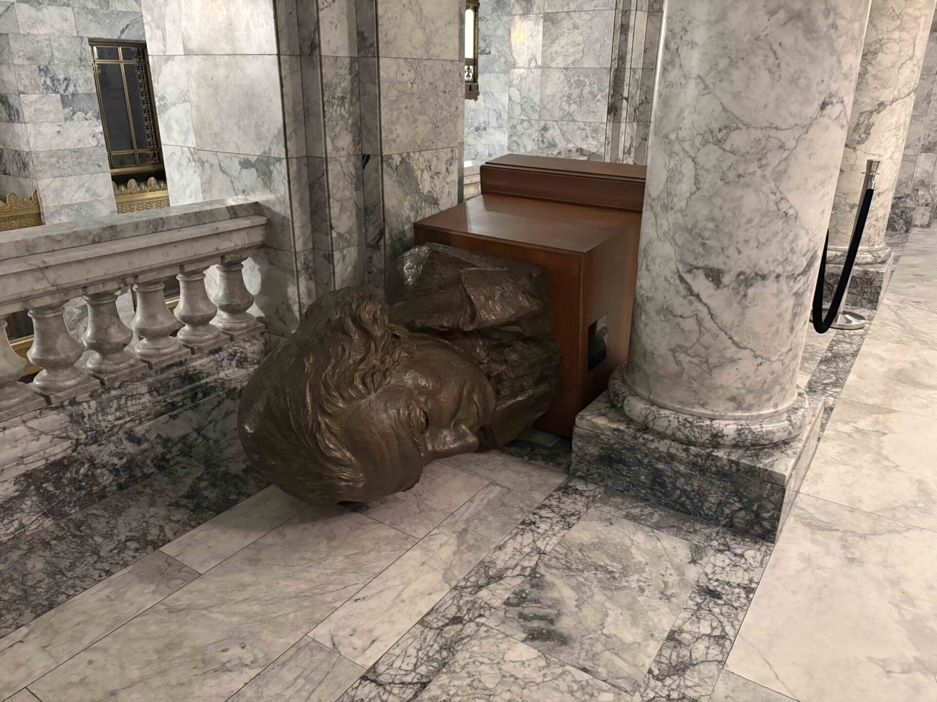 A bust of George Washington lies tipped over on the third floor of the Washington state Capitol building in Olympia