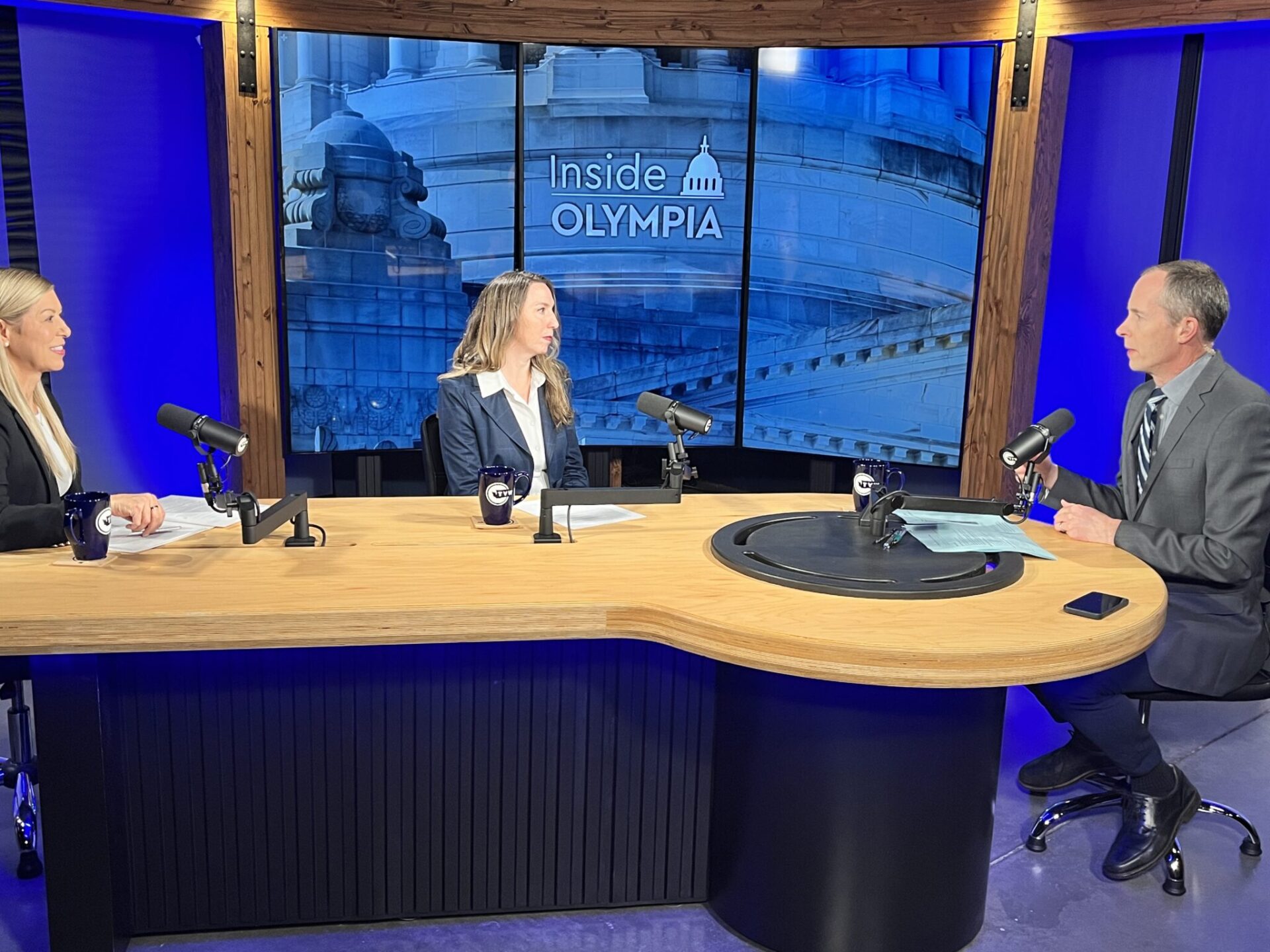 Washington state Chief Technology Officer Gretchen Peri, left, and Chief Privacy Officer Katy Ruckle, center, on the set of Inside Olympia with Austin Jenkins