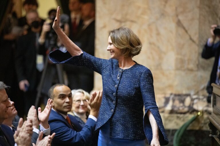 Insurance Commissioner Patty Kuderer waves to the room after being announced during the governor’s inauguration Wednesday, Jan. 15, 2025, at the Washington State Capitol in Olympia, Wash. Kuderer, the state’s first new insurance commissioner in 24 years, was also sworn in on Wednesday