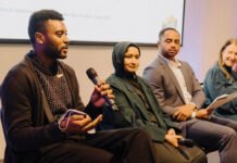 Democratic state Rep. Shaun Scott of Seattle (left) is proposing a new payroll tax on large employers in Washington. He took part in a discussion on the state’s tax system during the Budget Matters Summit on Nov. 12, 2025 in Seattle