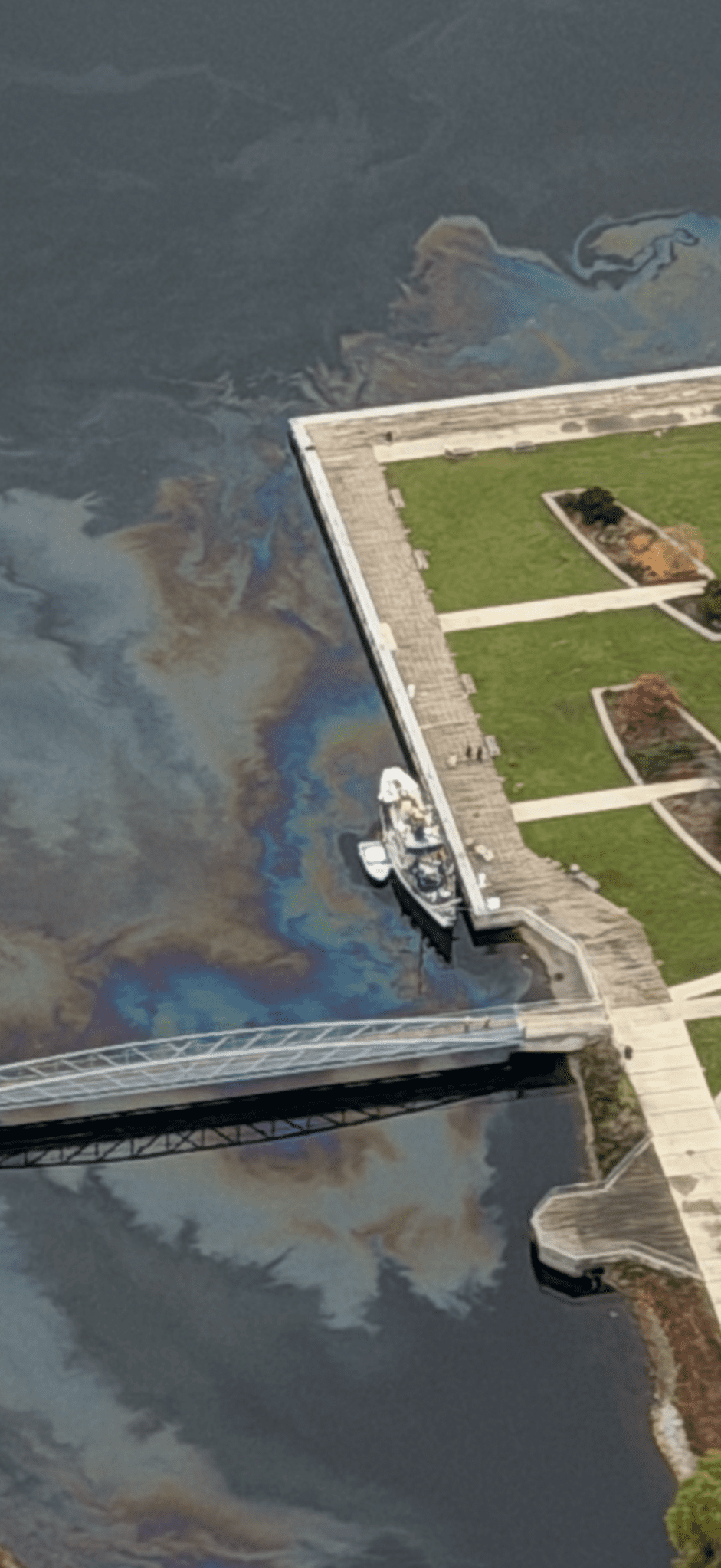 The Seattle Police Department’s Harbor Patrol Unit tows away a derelict vessel leaking fuel in Lake Union.
