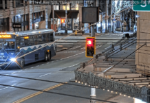 The suspect, wearing a blue backpack, moments after assaulting a Sound Transit Driver (RTCC).