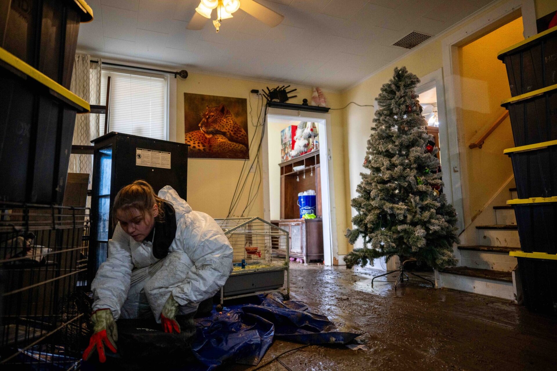 April Grant salvages belongings from her home in Sumas, Wash., on Dec. 15, 2025, after it flooded last week.