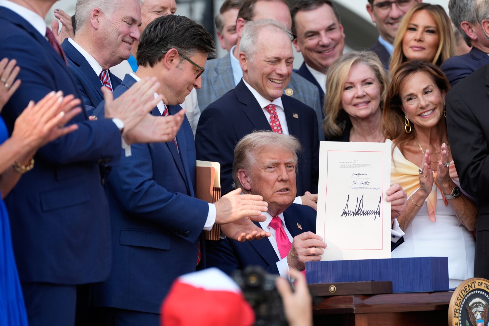 President Donald Trump holds up an executive order after signing it during an indoor inauguration parade at Capital One Arena on Jan. 20, 2025 in Washington, D.C. (Photo by Anna Moneymaker/Getty Images)