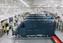 Employees work at a Rivian electric vehicle factory in Normal, Ill., in 2021