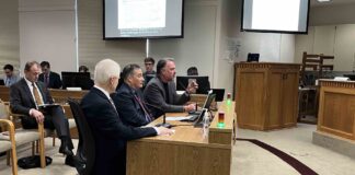 Foes called it the ‘initiative killer.’ Now it’s dead in the WA Legislature Let’s Go Washington leader Brian Heywood, far end of table, testifies before the state Senate’s State Government, Tribal Affairs and Elections Committee on Jan. 20, 2026. Center is Secretary of State Steve Hobbs. Next to Hobbs is former Secretary of State Sam Reed. All three testified against Senate Bill 5973, which would impose new restrictions on payments for initiative signature gathering and require at least 1,000 signatures be submitted as part of the filing of a proposed initiative or referendum. In the background, to the left is political activist Tim Eyman. (Photo by Bill Lucia/Washington State Standard)