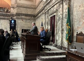 Mariners catcher Cal Raleigh was ‘robbed’ of MVP, WA Senate resolves Longtime Mariners broadcaster Rick Rizzs waves to the Capitol press corps on the Washington state Senate floor as the team is honored Monday, Feb. 2, 2026