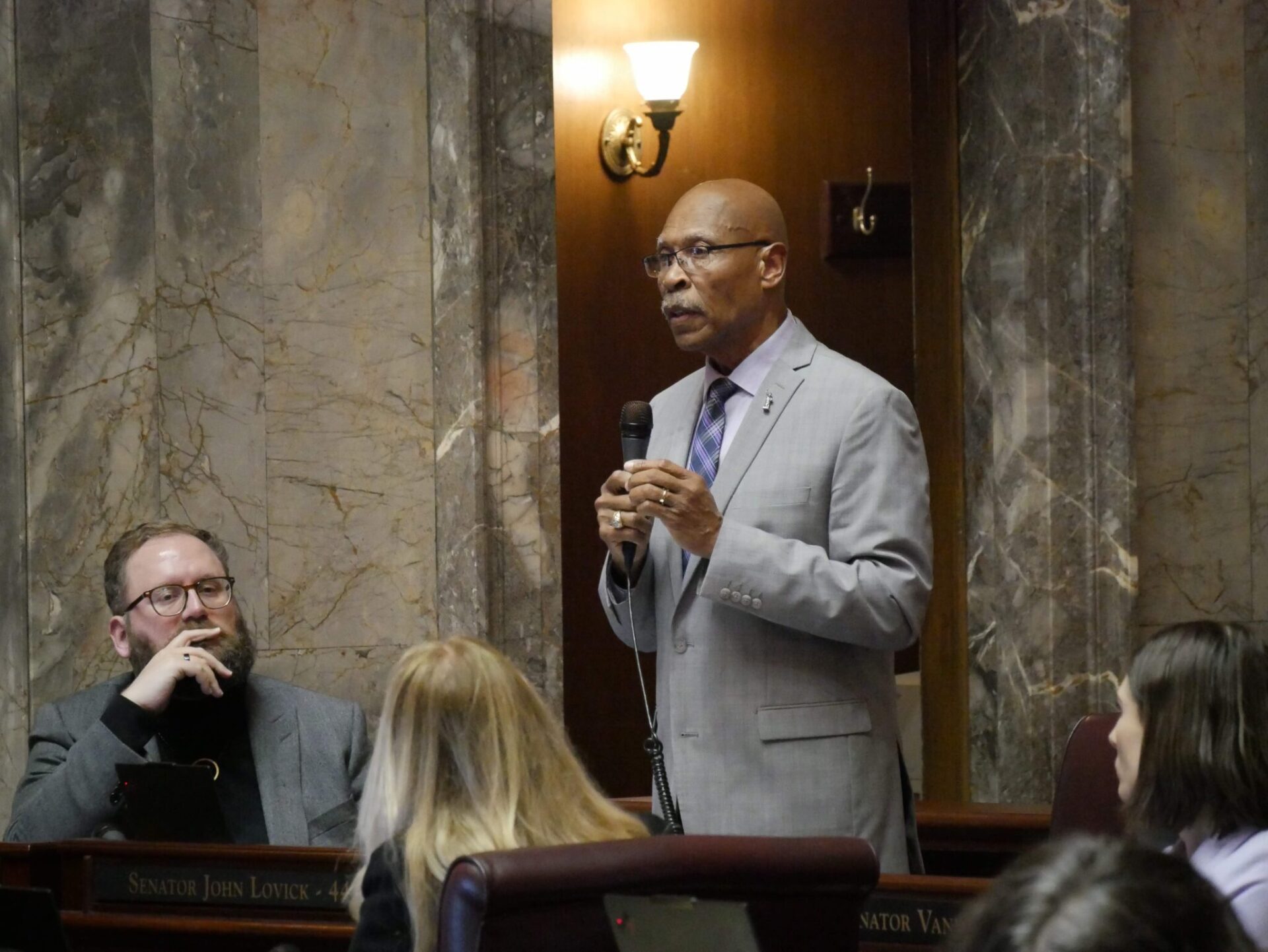 Sen. John Lovick, D-Mill Creek, on the Senate floor on Feb. 12, 2026, remarks about his bill to set stricter standards for sheriffs. The legislation was approved, sending it to the House