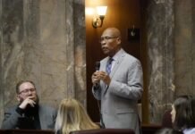 Sen. John Lovick, D-Mill Creek, on the Senate floor on Feb. 12, 2026, remarks about his bill to set stricter standards for sheriffs. The legislation was approved, sending it to the House