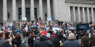 Supporters of Let’s Go Washington initiatives intended to bolster parental rights and block transgender athletes from girls’ sports, gather on the north steps of the Washington state Capitol on Tuesday, Feb. 3, 2026