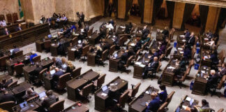 Washington state lawmakers in the House chamber on the first day of the 2026 legislative session