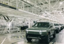 Rivian vehicles lined up at one of the company’s manufacturing facilities.