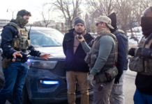 Ban on police face coverings in WA nears final passage in Legislature ICE agents allow a driver to talk to his wife as they arrest him and his passenger during a traffic stop on Feb. 11, 2026 in Minnesota