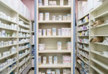 Pharmaceutical giants sue WA over new drug pricing law Medications are stored on shelves at a pharmacy