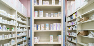Pharmaceutical giants sue WA over new drug pricing law Medications are stored on shelves at a pharmacy