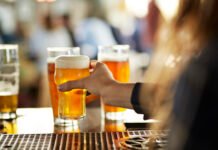 serving beers at bar
