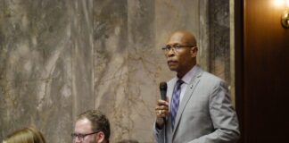 Sen. John Lovick, D-Mill Creek, on the Senate floor on Feb. 12, 2026, prepares to make remarks on his bill to set stricter standards for sheriffs. The legislation was approved, sending it to the House