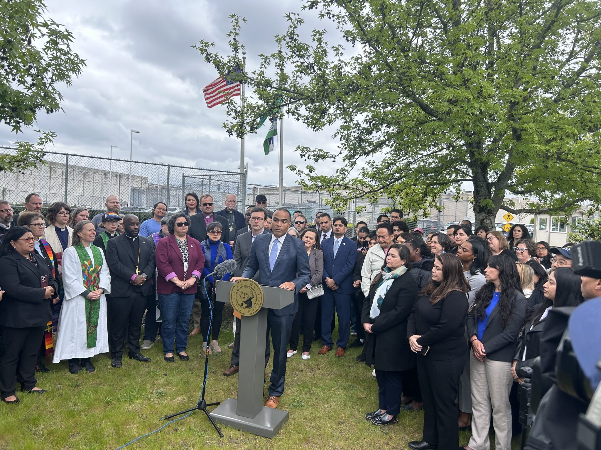 Washington Attorney General Nick Brown speaks to reporters alongside Gov. Bob Ferguson and community leaders outside the Northwest ICE Processing Center on Tuesday, April 28, 2026, in Tacoma. (Photo by Jake Goldstein-Street/Washington State Standard)