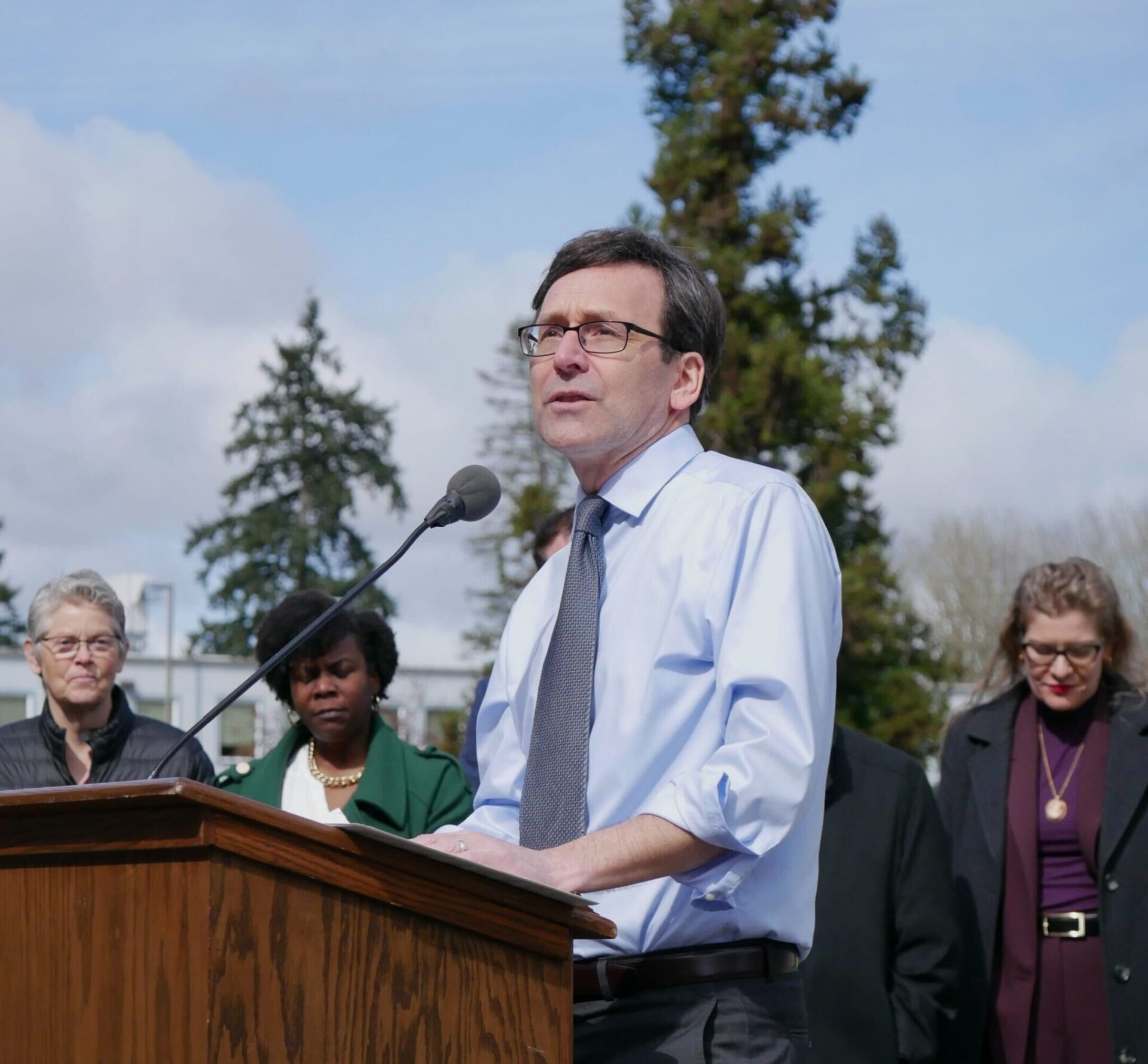 Gov. Bob Ferguson, pictured at a rally after signing the law establishing an income tax on millionaires, is the target of a recall petition for failing to fill vacancies on the commission that enforces state campaign finance laws