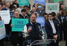 Let's Go Washington founder Brian Heywood asked the Washington Supreme Court on Friday to allow a referendum effort on the state's new income tax law. Heywood is pictured at a rally in February on the group's initiatives to bolster parental rights and block transgender participants from girls' sports that are on the ballot in November