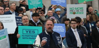 Let's Go Washington founder Brian Heywood asked the Washington Supreme Court on Friday to allow a referendum effort on the state's new income tax law. Heywood is pictured at a rally in February on the group's initiatives to bolster parental rights and block transgender participants from girls' sports that are on the ballot in November