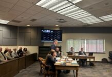 Mark Lamb, the attorney for four eastern Washington sheriffs, speaks in Thurston County Superior Court against a new law setting heightened eligibility standards for sheriffs as several county sheriffs observe on Wednesday, April 29, 2026