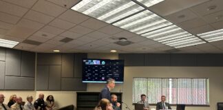 Mark Lamb, the attorney for four eastern Washington sheriffs, speaks in Thurston County Superior Court against a new law setting heightened eligibility standards for sheriffs as several county sheriffs observe on Wednesday, April 29, 2026