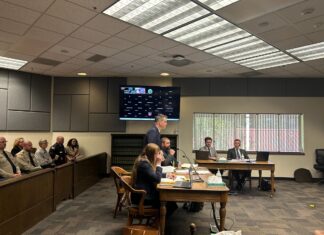 Mark Lamb, the attorney for four eastern Washington sheriffs, speaks in Thurston County Superior Court against a new law setting heightened eligibility standards for sheriffs as several county sheriffs observe on Wednesday, April 29, 2026