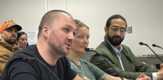 Cory Maxwell of Kitsap County (left) called on some members of the Washington Fish and Wildlife Commission to step down in public comments on April 17, 2026. Rachel Bjork and Francisco Santiago-Avila look on.