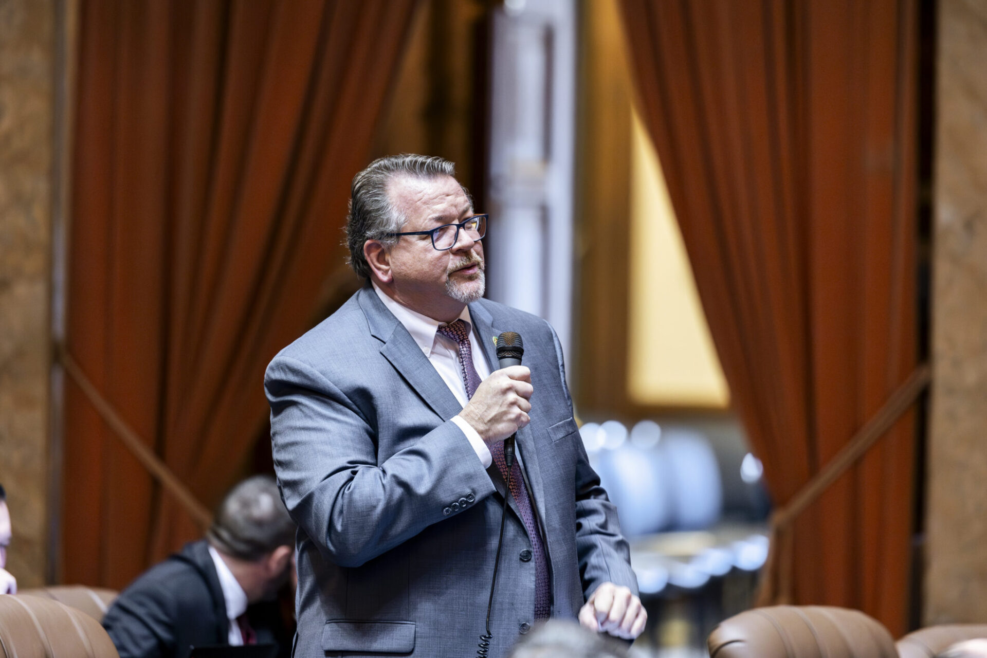 Former state Rep. Eric Robertson speaks on the House floor in 2024
