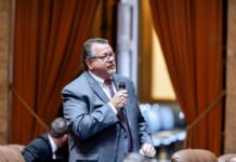 Former state Rep. Eric Robertson speaks on the House floor in 2024