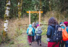 embers of the Elwha Legacy Forests Coalition walk on a trail near the state-managed Sadie Creek Campground near the Northern Olympic Coast.