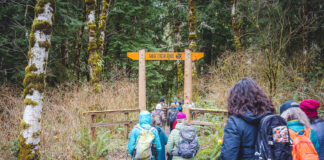 embers of the Elwha Legacy Forests Coalition walk on a trail near the state-managed Sadie Creek Campground near the Northern Olympic Coast.