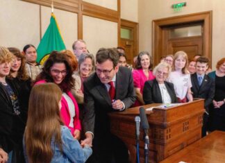 Judge rejects lawsuit against rewrite of WA parental rights law Gov. Bob Ferguson hands over one of the pens he used to sign House Bill 1296, the ‘students bill of rights’ to a child who attended the bill signing