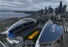 Grass grows beneath lamps during an aerial view of Seattle Stadium on May 6, 2026 in Seattle, Washington. Seattle Stadium, officially named Lumen Field, will host six matches during the 2026 FIFA World Cup.