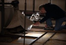 Earlier this year, state staff and contractors viewed potential materials, like glass panels, for the restoration of skylights above the Washington state Capitol legislative chambers in Olympia.