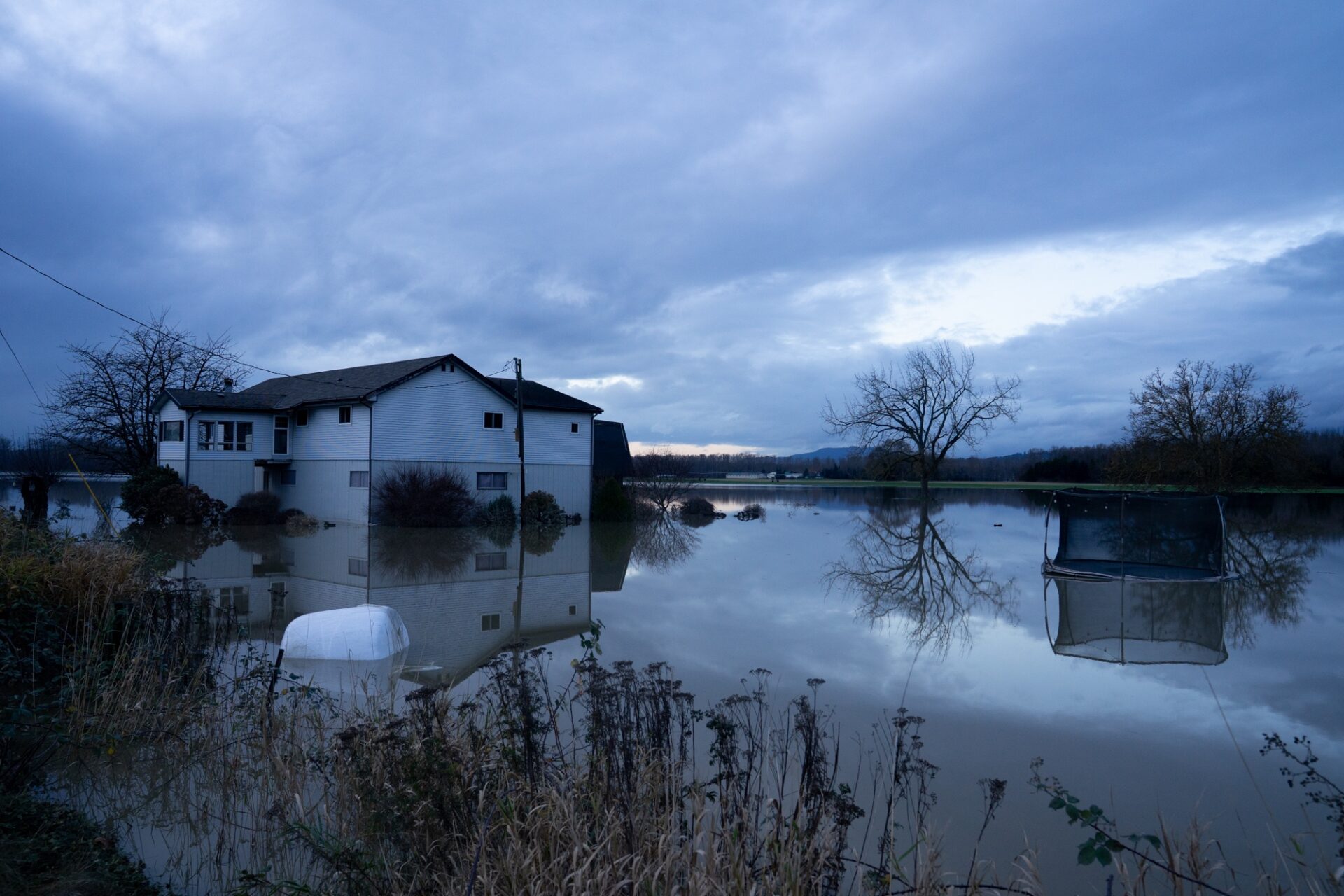 A house off Francis Road in Silver Lake, about a half hour outside of Concrete, still submerged in floodwater on Dec. 17, 2025