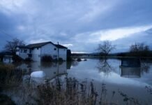 A house off Francis Road in Silver Lake, about a half hour outside of Concrete, still submerged in floodwater on Dec. 17, 2025