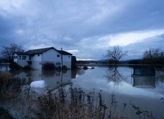 A house off Francis Road in Silver Lake, about a half hour outside of Concrete, still submerged in floodwater on Dec. 17, 2025
