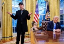 Billionaire Elon Musk, left accompanied by U.S. President Donald Trump, right, and Musk’s son, X Musk, speaks during an executive order signing in the Oval Office at the White House on Feb. 11, 2025 in Washington, D.C.