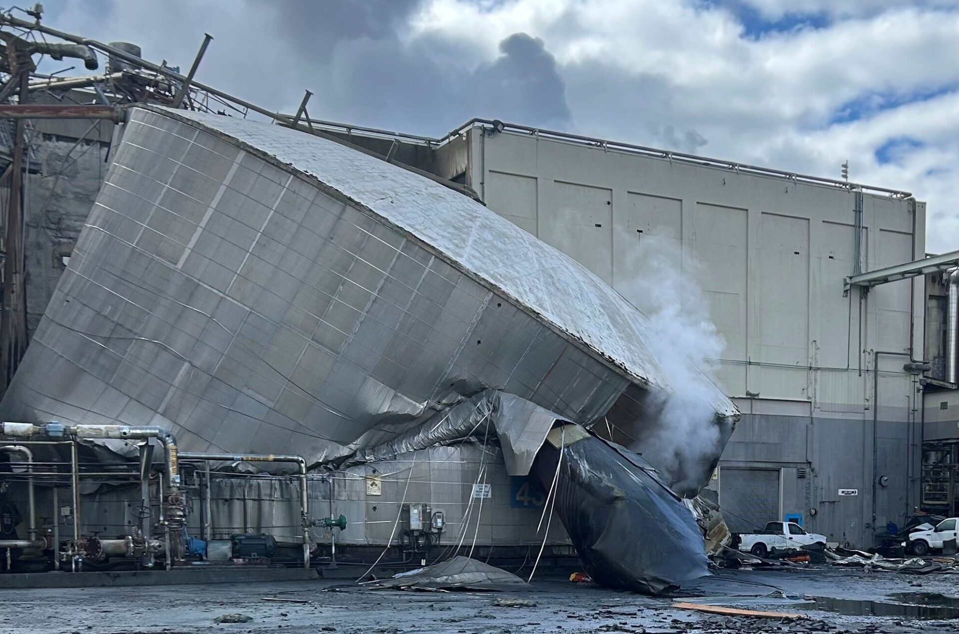 The burst white liquor tank is seen at the Nippon Dynawave Packaging facility in Longview, Wash. on May 26, 2026