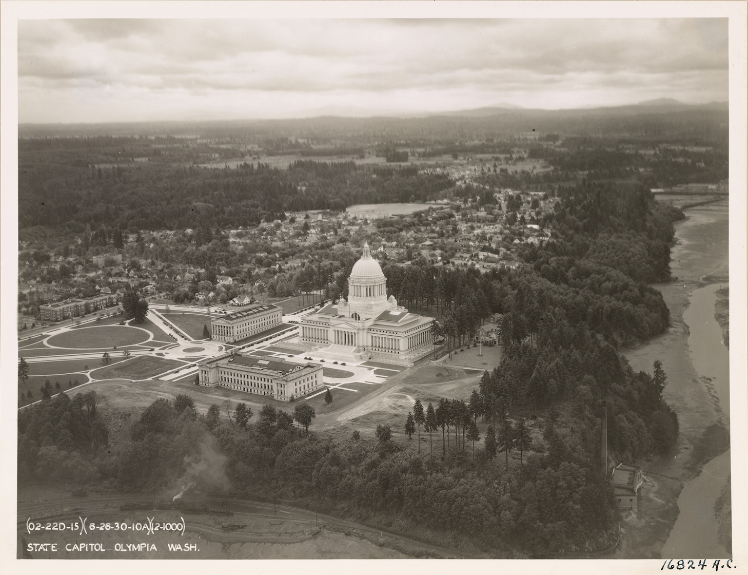 An aerial photo of the Washington state Capitol in 1931. A close look at the left and right flanks of the building reveals the later decommissioned skylights. (Photo courtesy of Washington State Archives via National Archives)
