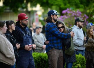 Confirmed death toll rises to 2 from chemical tank blast in southwest Washington Community members comfort each other during a vigil at R.A. Long Park following a fatal chemical storage tank failure on May 26, 2026 in Longview, Washington.