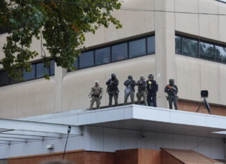 As Trump admin sues states over federal agent mask bans, Northwest remains on sidelines Federal officers shoot pepper balls at protestors at the ICE facility south of downtown Portland on Sunday, Oct. 12, 2025