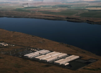 An explosion of data center facilities, including the one pictured here in Umatilla County on May 18, 2026, have been built in Oregon along the Columbia River Gorge during the last few years. The boom has caused a more than 500% load growth for the Umatilla Electric Cooperative during the last decade, which has had to buy more gas and coal-powered electricity on the wholesale market to meet demand