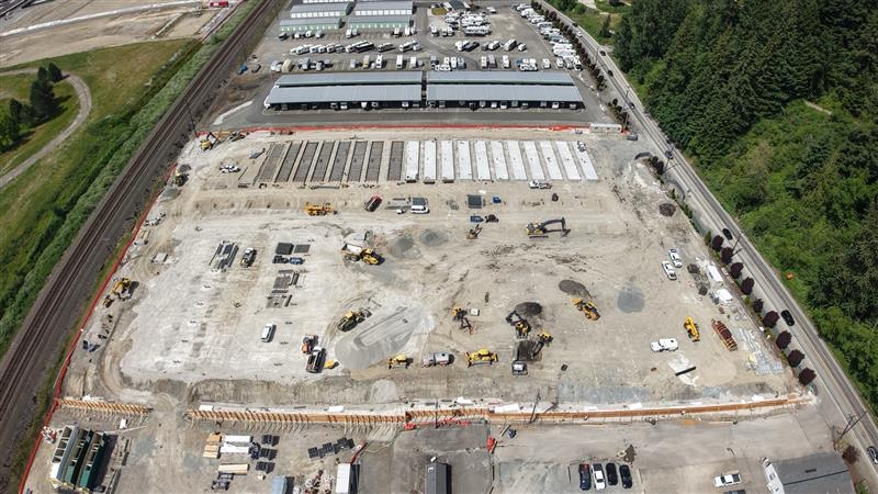 The first large-scale battery energy storage facility in Puget Sound Energy territory is under construction in Sumner, Washington. Developers BrightNight and Cordelio Power expect their Greenwater BESS project (inside the orange fencing) to become operational by the end of 2026. (Photo courtesy of BrightNight Power)