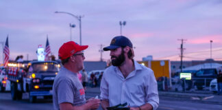 Trump looms large as 11 candidates vie to replace Dan Newhouse in central WA Republican Jerrod Sessler and Devin Pooré, a Cascade Party candidate, talk before the Spring Fest parade in Moses Lake, Wash., on May 23, 2026. Both men are running to represent Washington’s 4th Congressional District in the 2026 primary.