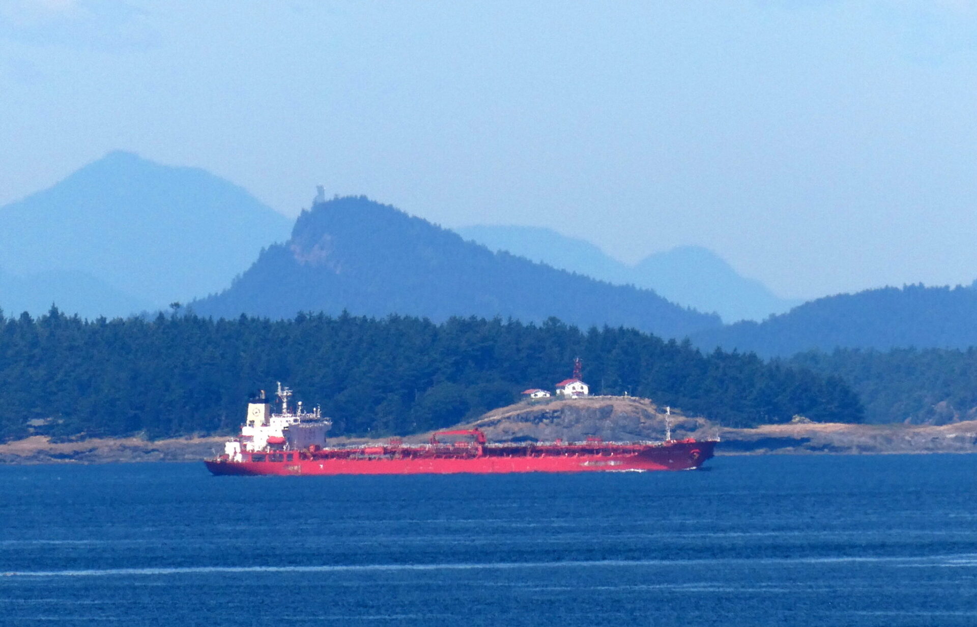 Increased tanker traffic through the shared border waters of Washington and British Columbia could rise further if Alberta succeeds in building a new crude export pipeline to the West Coast. Here, an oil/chemical tanker steers through Boundary Pass on the way to the Port of Vancouver in late June